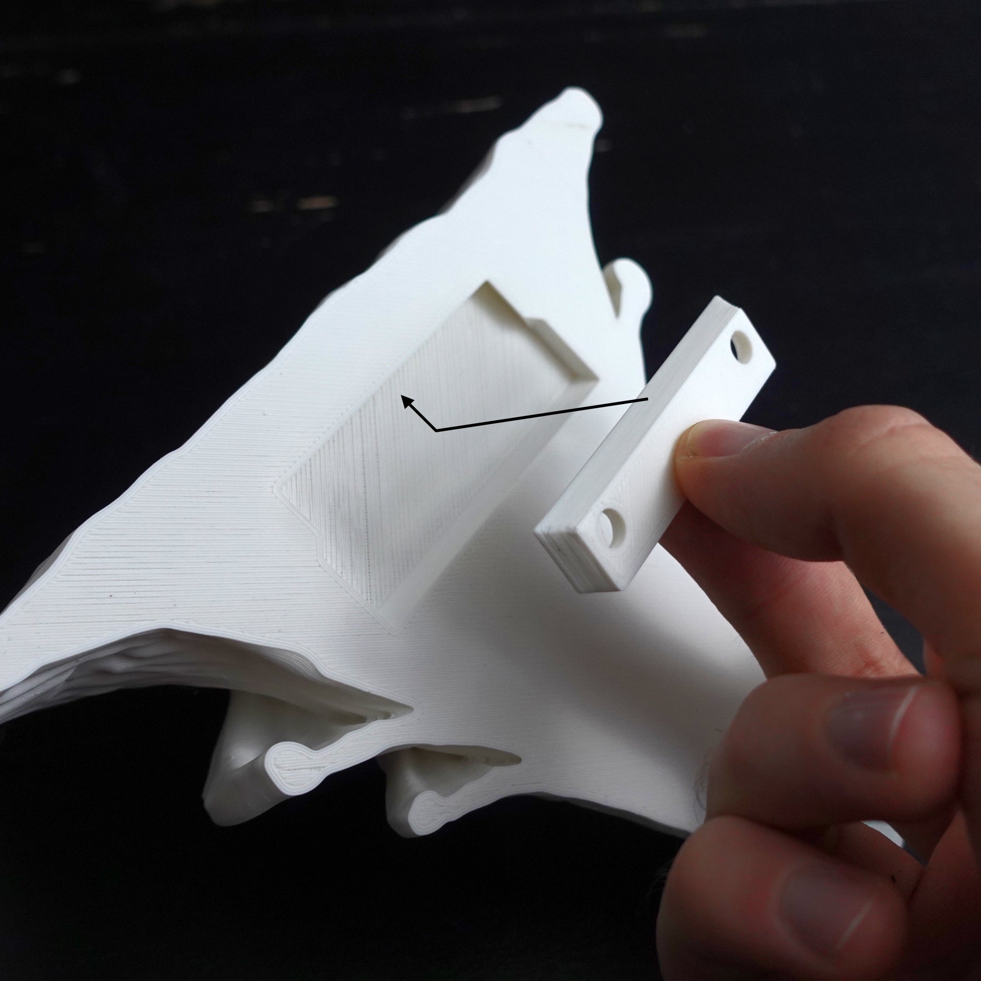 Close-up view of white 3D printed Djamor Fungus shelf demonstrating mounting mechanism, highlighting its sturdy and reliable construction.