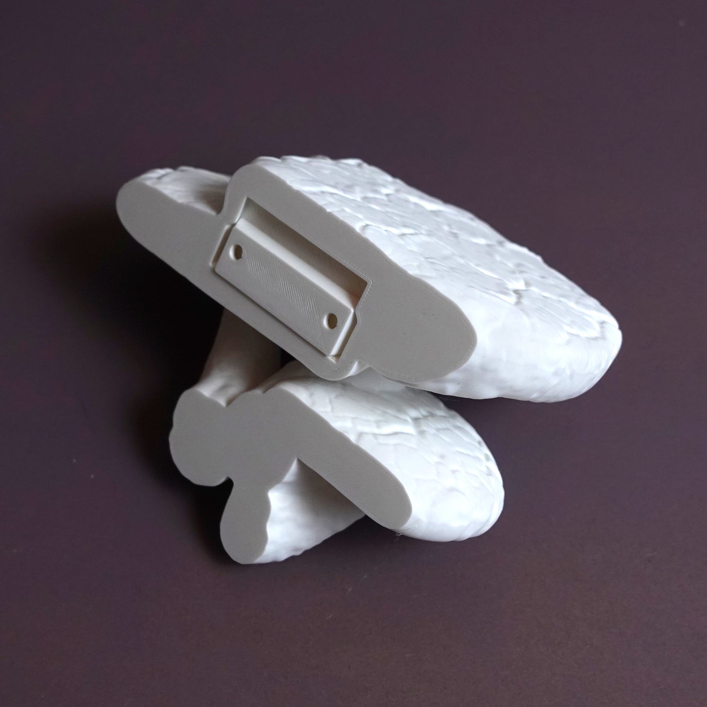 Bottom view of a white Edodes fungus floating shelf, highlighting its sturdy design and eco-friendly features.