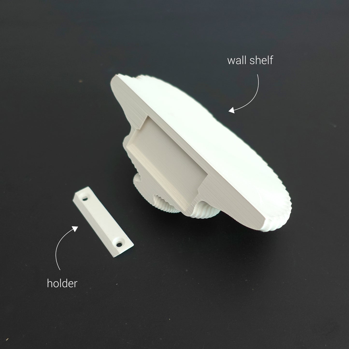 White floating shelf with wall holder shown on a black backdrop, detailing construction and mounting options.