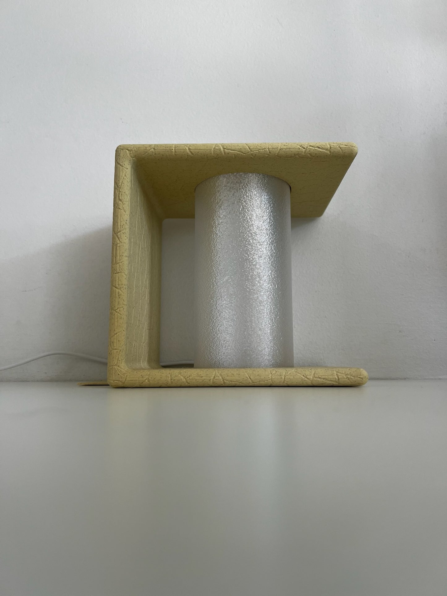 Stylish Ancient Marble Bookend casting soft light, ideal for bookshelves or study areas.