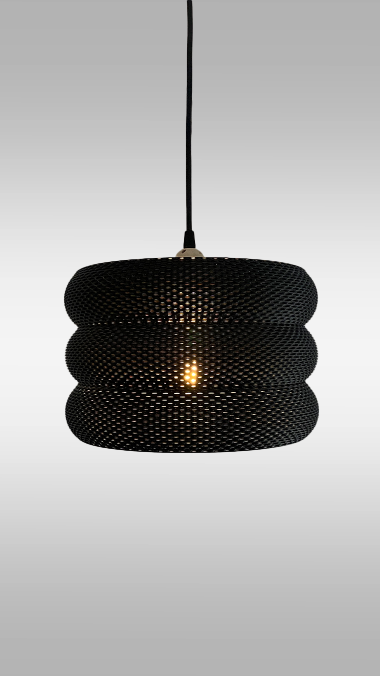Close-up view of the elegant Mara Lampshade showcasing its unique curved structure and light diffusion, perfect for modern decor.