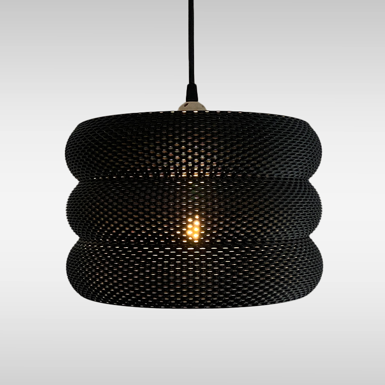 Close-up view of the elegant Mara Lampshade showcasing its unique curved structure and light diffusion, perfect for modern decor.