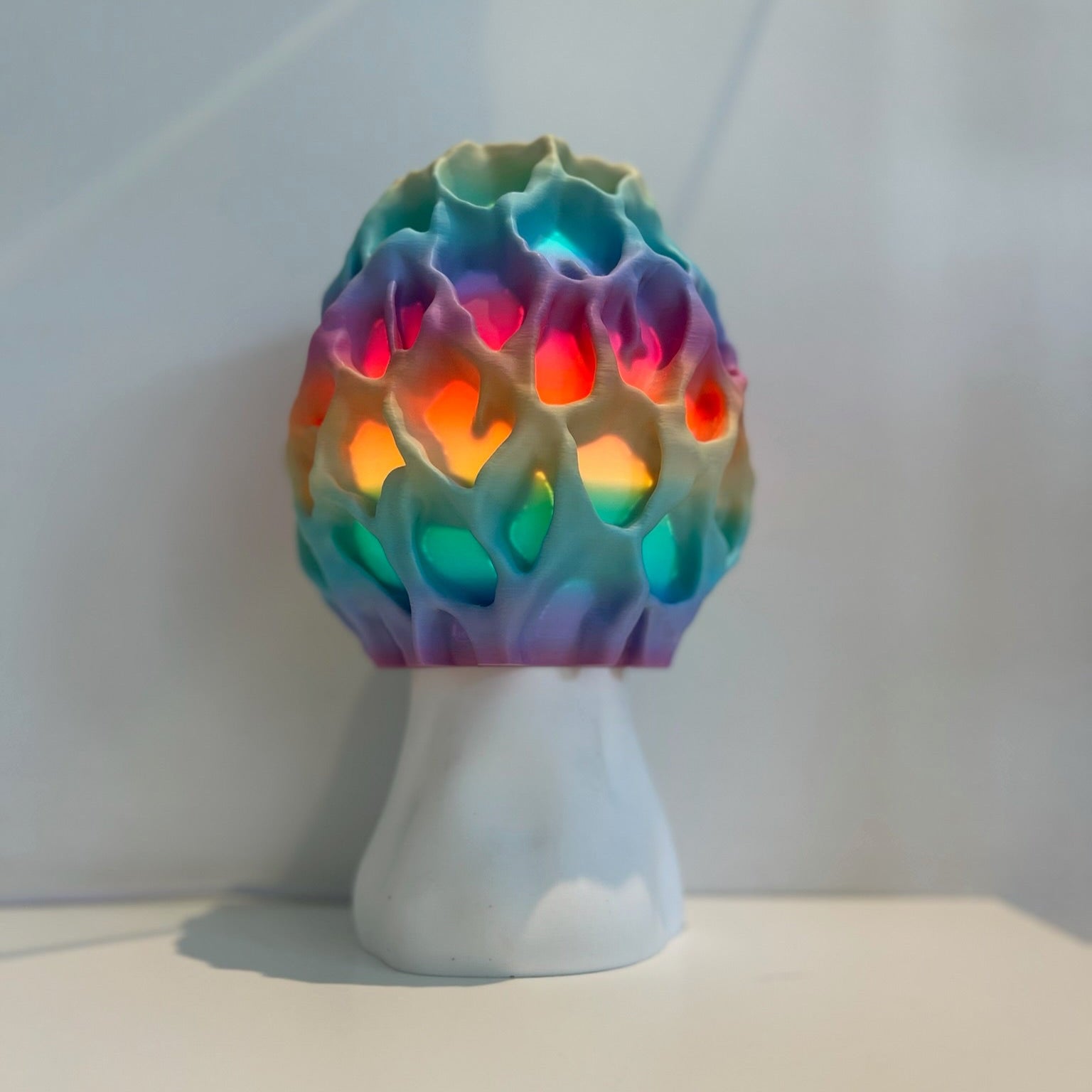 Artistic display of Morel lamp illuminating a cozy study space, creating a warm atmosphere.