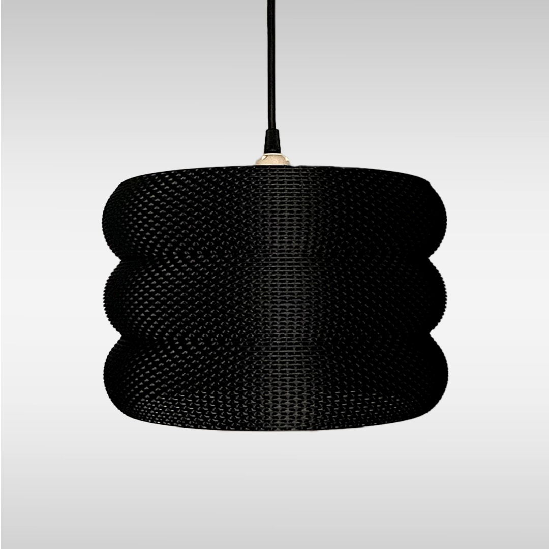 Side view of the Mara Lampshade displaying its elegant contours and artistic RippleMesh texture, ideal for enhancing indoor lighting.