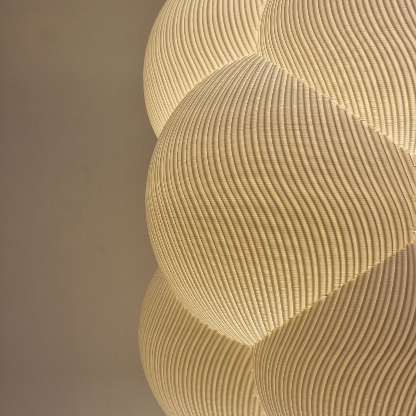 Detailed perspective of the textured surface of the Cumulus Cloud lampshade, showcasing its playful form and light diffusion capabilities.