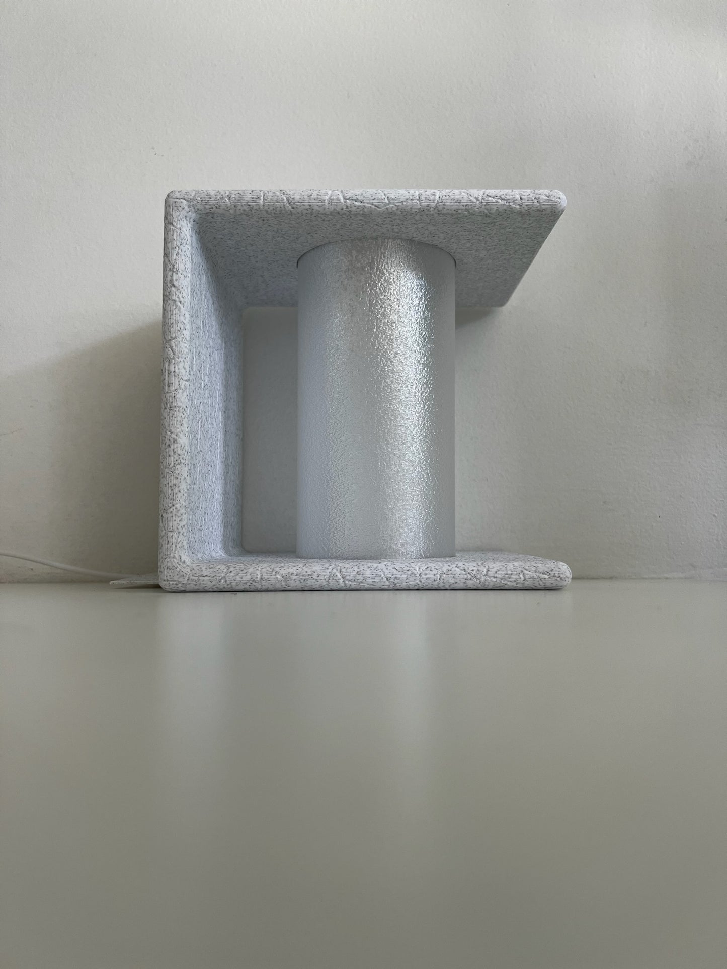 Ancient Marble Bookend displaying a unique design with warm lighting aesthetics.