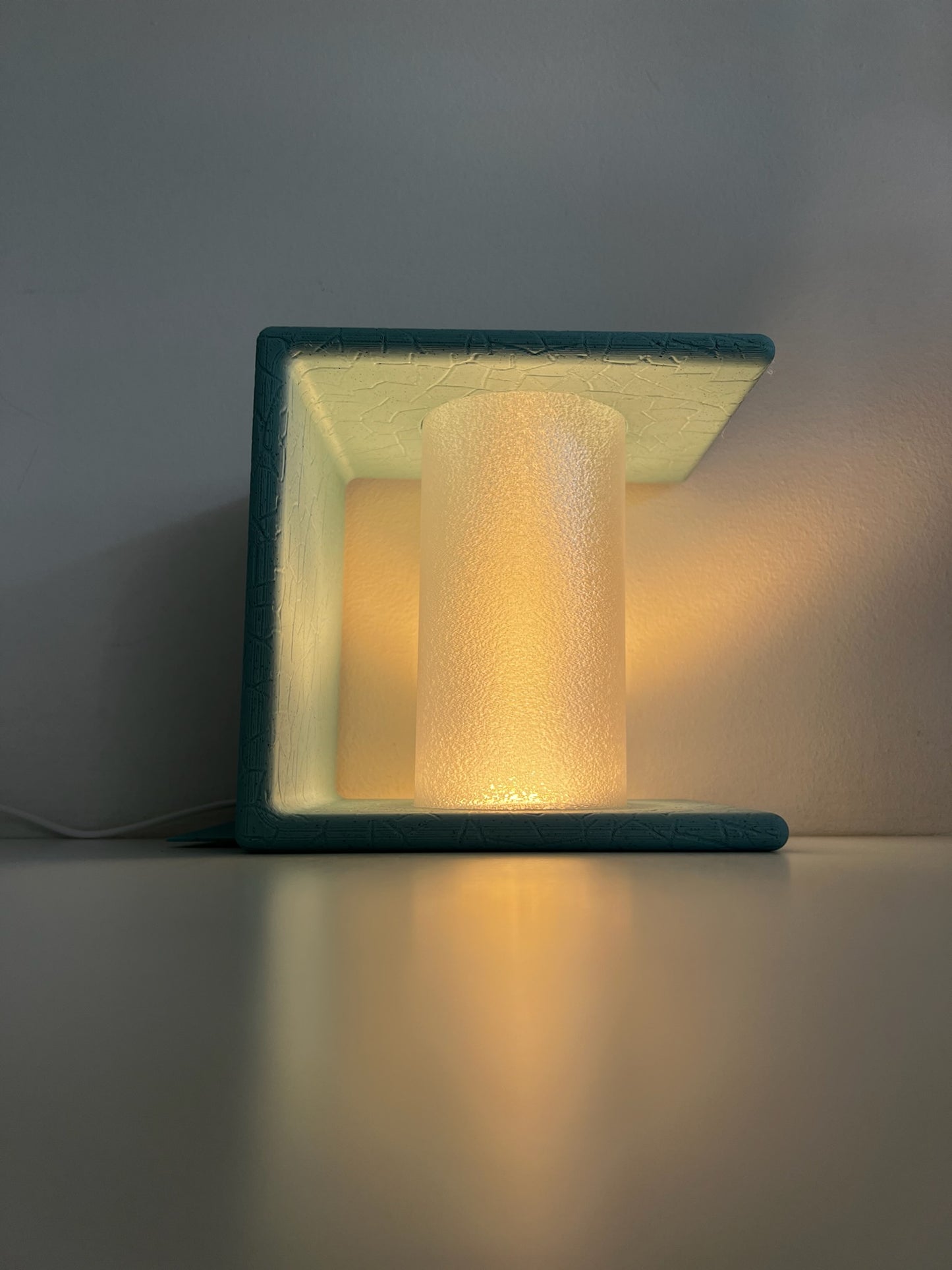 Close-up of an Ancient Marble Mood Setting Bookend emitting a warm light, enhancing the cozy atmosphere.