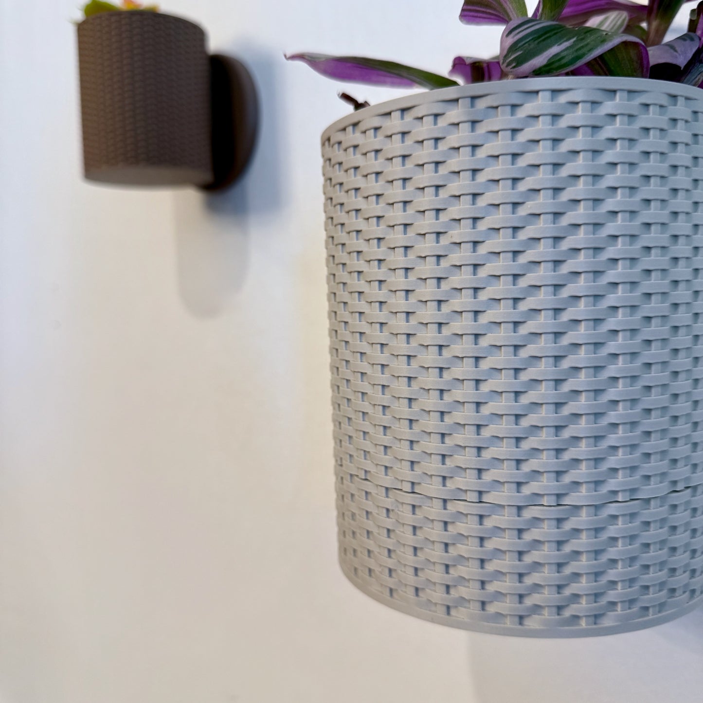 Basketweave Planter with Cascading Green Plant – A warm-toned planter with a sophisticated weave texture, enhancing any indoor space.