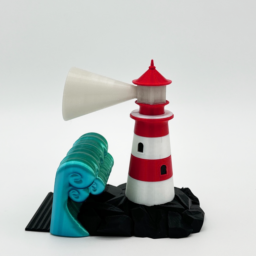 Colorful lighthouse bookend showcasing intricate details and bright colors on a white background.