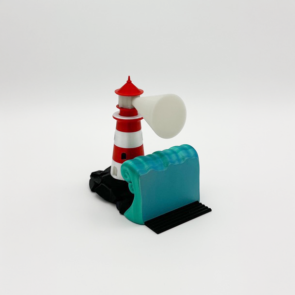 Lighthouse bookend design with vibrant red and white colors and a decorative green wave, perfect for home decor.