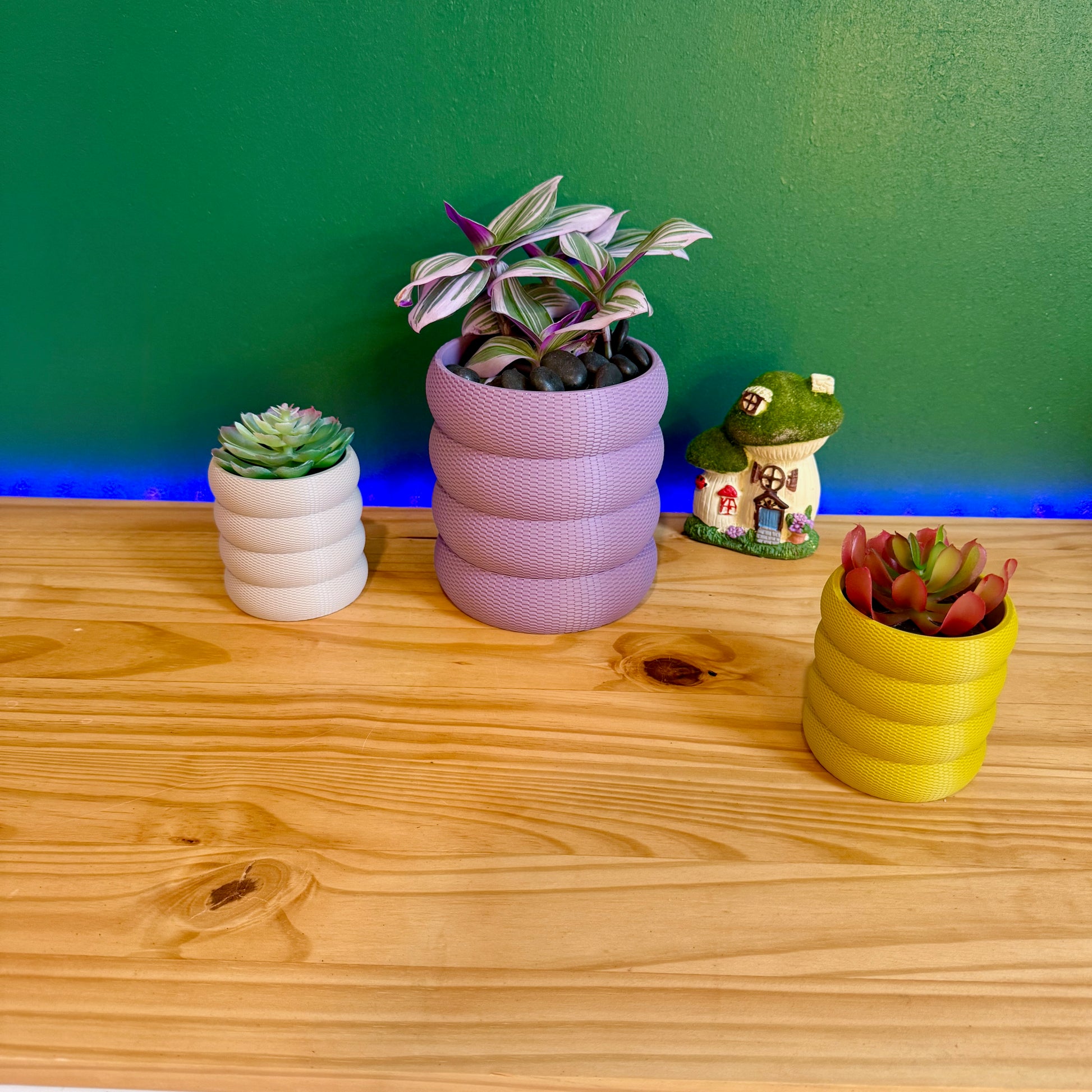 A beautifully textured wall-mounted planter with a unique bubble weave design, available in multiple colors to enhance any space.