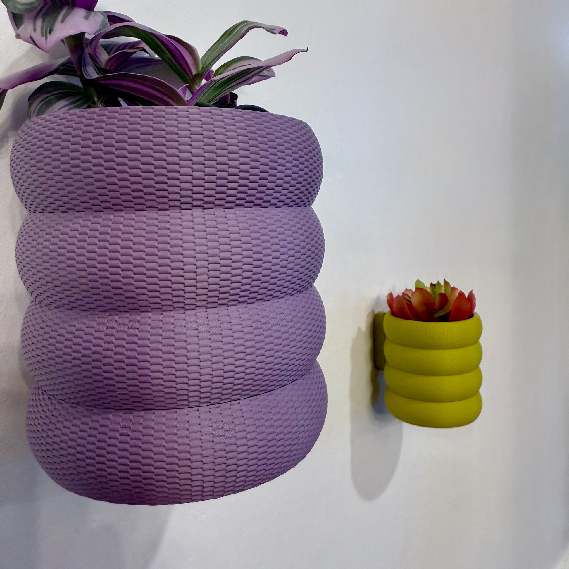 A contemporary bubble weave planter in eye-catching colors, designed to add dimension and style to your home decor.