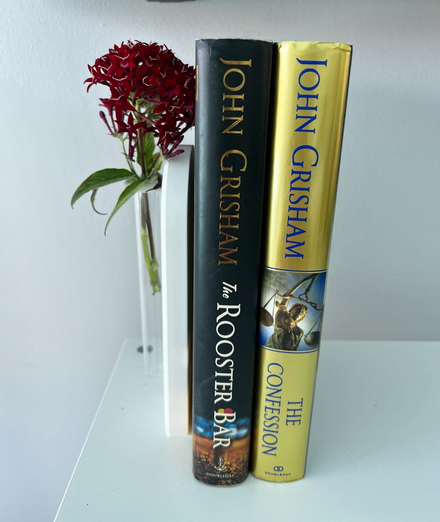 Beautiful propagation bookend with a glass tube for plant growth, showcasing vibrant florals against a plain background.