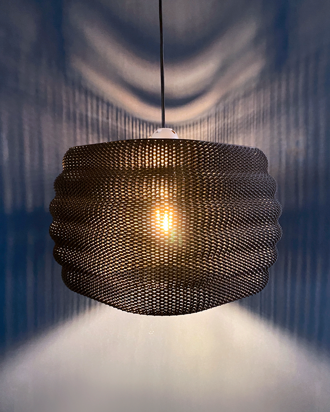 Daira Lampshade in a striking design with rich orange tones, showcasing a unique texture that enhances its visual appeal.