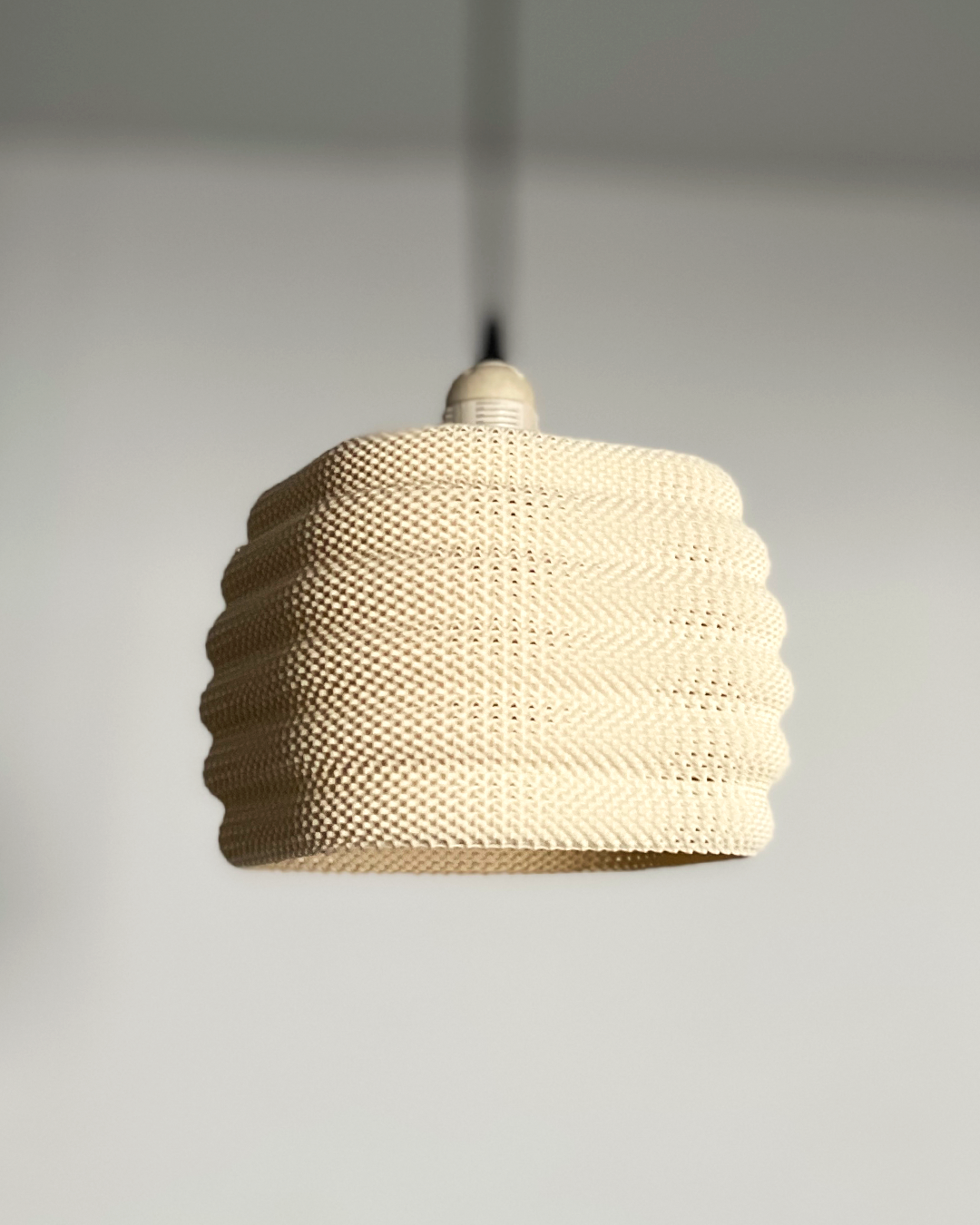Daira Lampshade in a soft cream color, featuring a modern woven design that adds subtle elegance to any room.