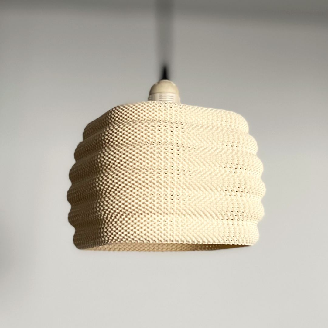 Daira Lampshade in a soft cream color, featuring a modern woven design that adds subtle elegance to any room.