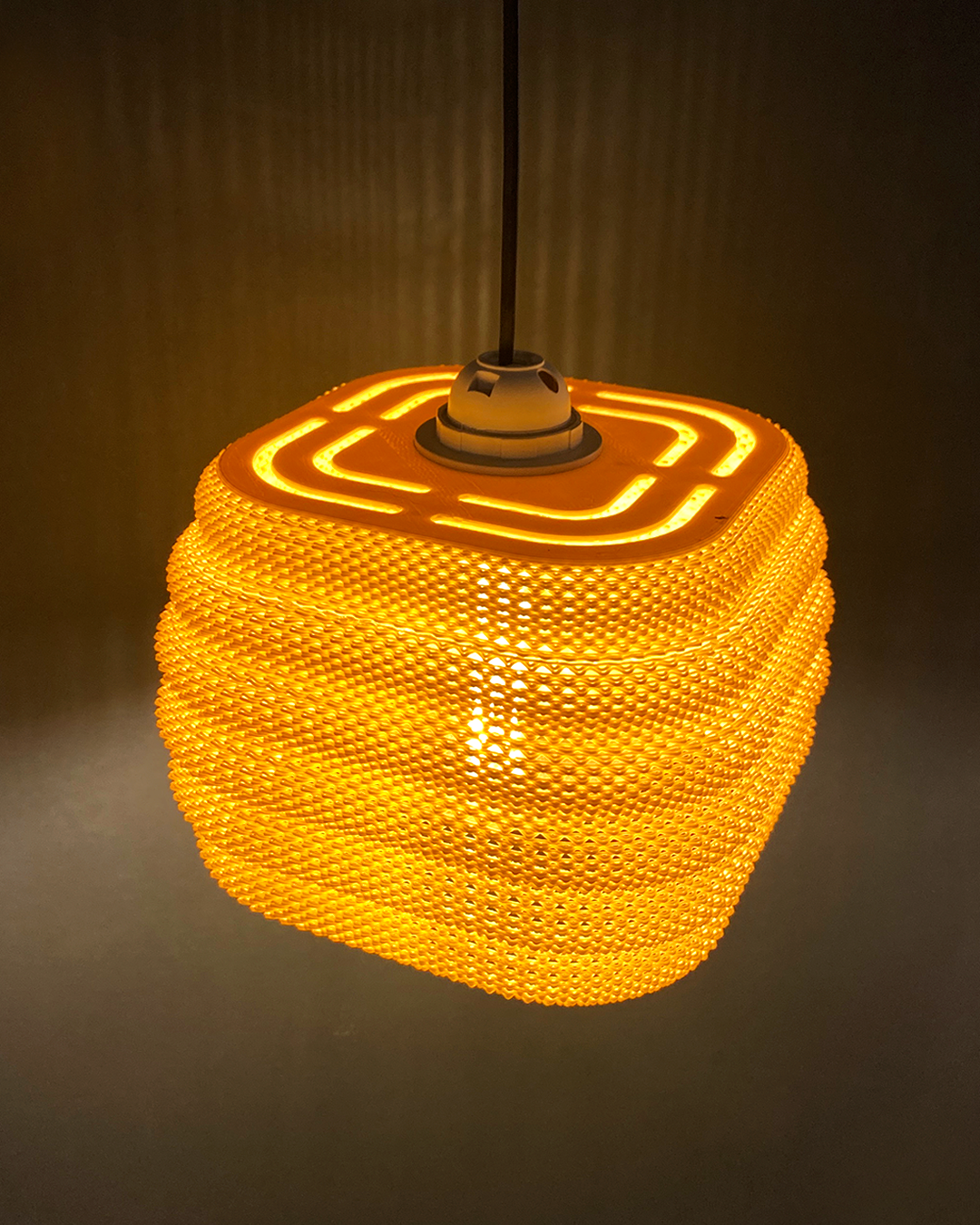 Daira Lampshade in orange with a contemporary square top, illuminating beautifully to enhance interior decor.