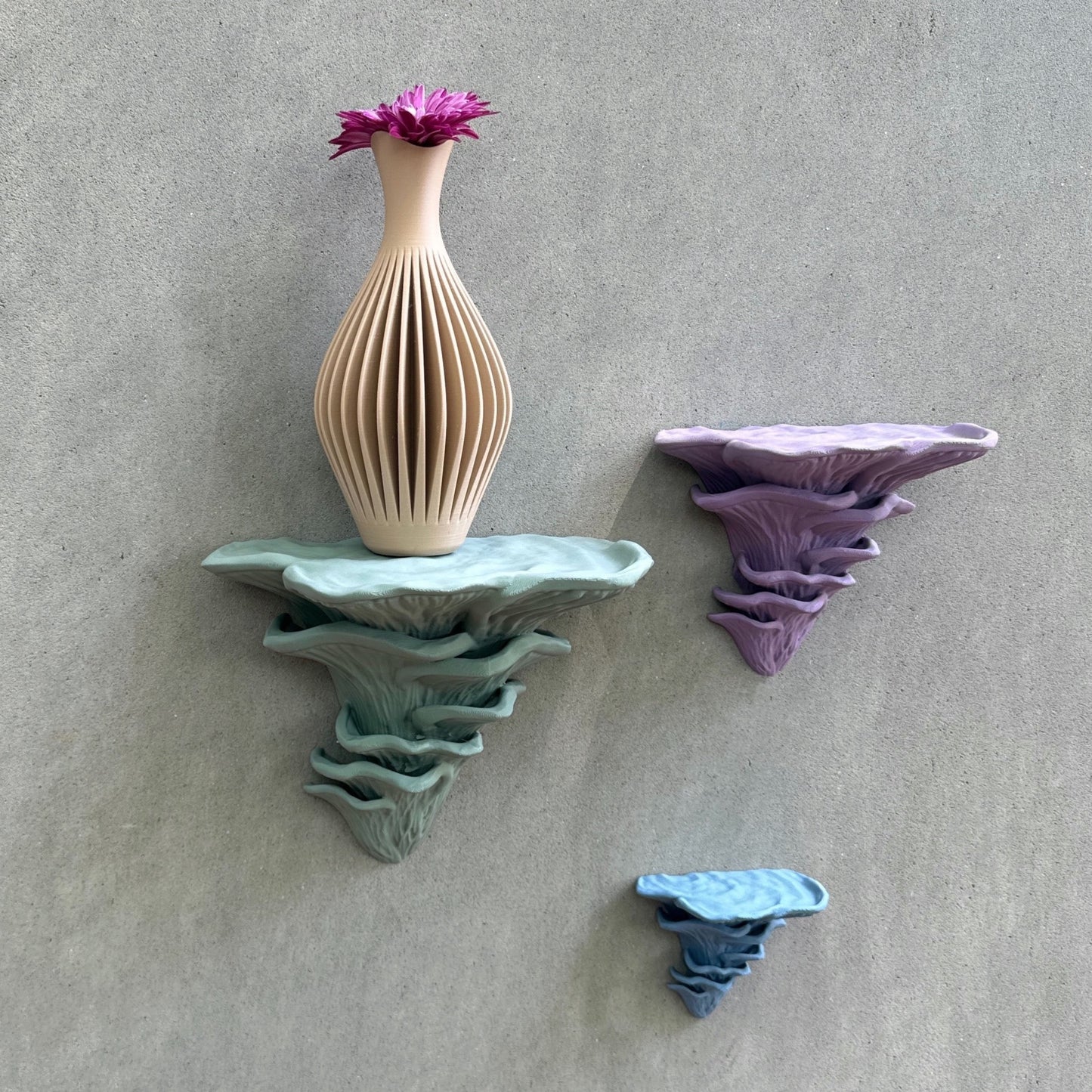 Djamor Floating Mushroom Shelves displaying a beautiful flower vase, emphasizing their unique mushroom-inspired design.