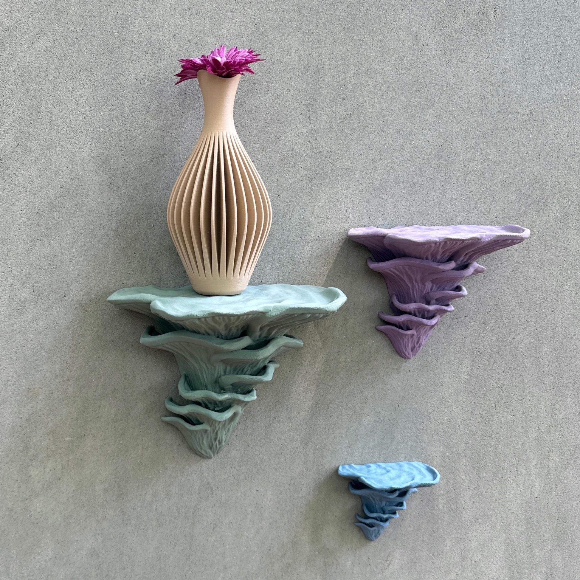 Djamor Floating Mushroom Shelves displaying a beautiful flower vase, emphasizing their unique mushroom-inspired design.
