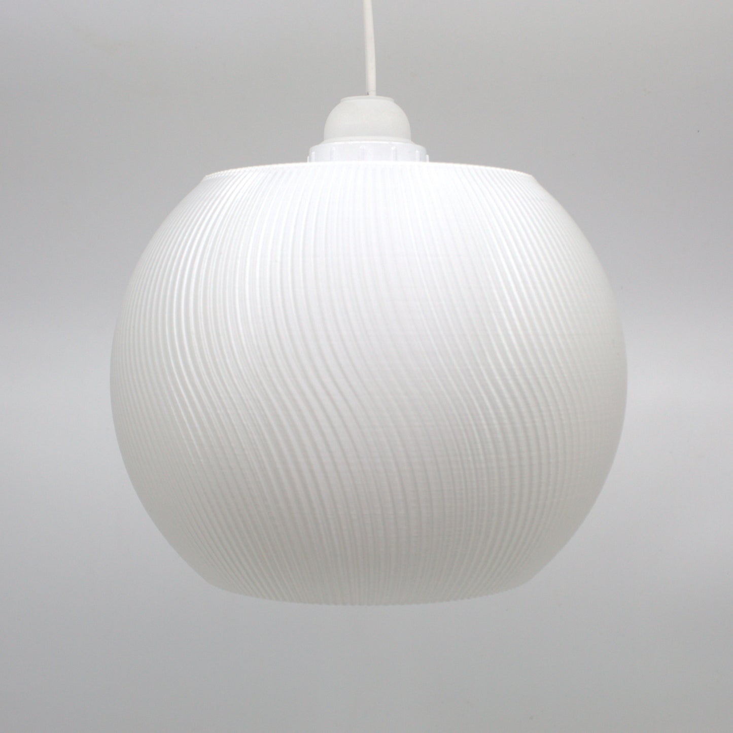 Elegant white lampshade with a ribbed texture, ideal for creating a cozy atmosphere in any room.