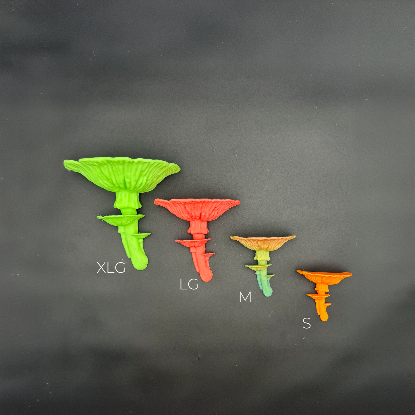 Size comparison of four Amanita mushroom floating shelves labeled Small, Medium, Large, and X Large, demonstrating their unique designs and varying dimensions.