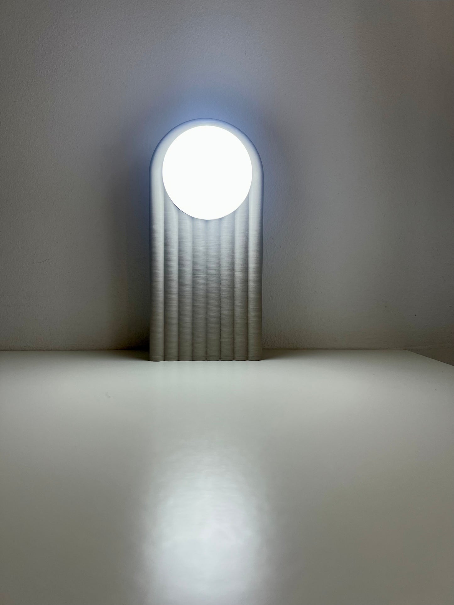 Sleek lighted bookend illuminating a flat surface, showcasing its elegant and modern look.