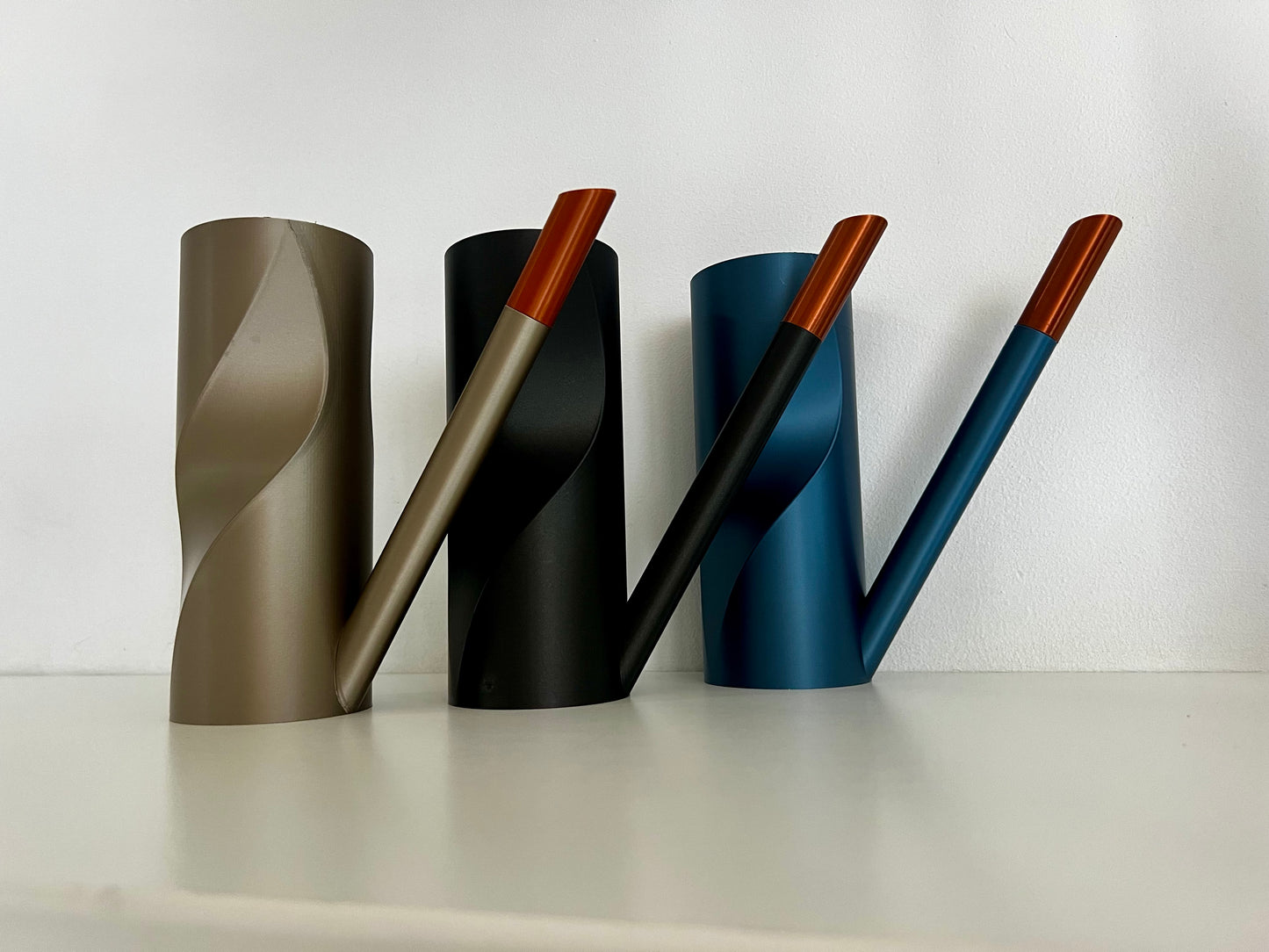 A variety of stylish watering cans demonstrating sleek designs and vibrant colors, perfect for contemporary living.