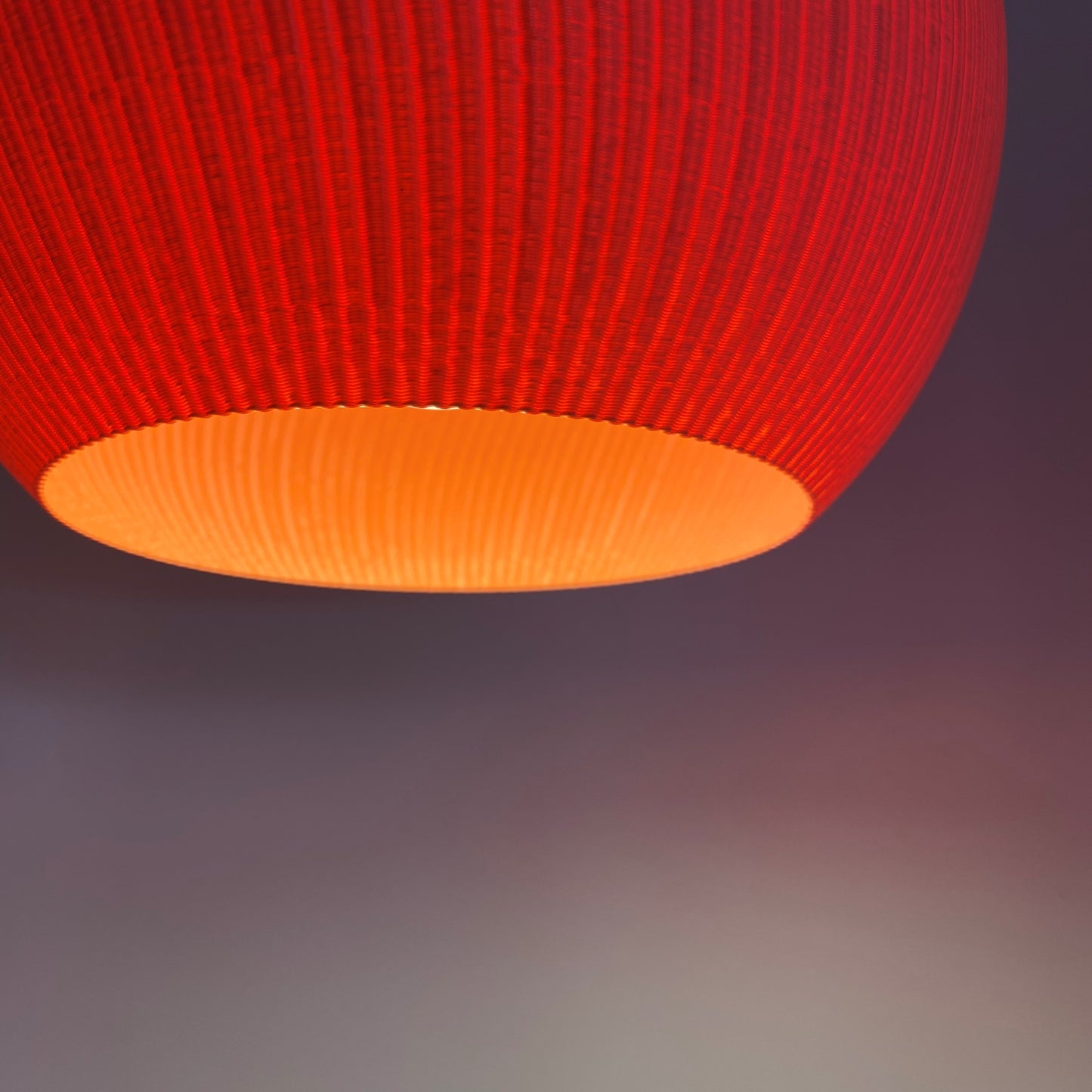 Artistic white lampshade captured in close-up, displaying its unique ribbed design for enhanced lighting.