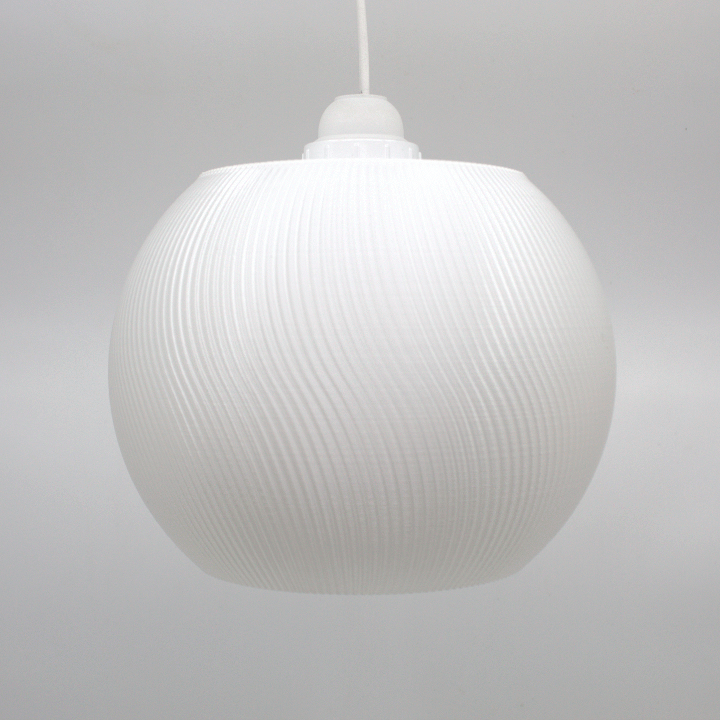 Modern white lampshade with a textured surface, perfect for adding a whimsical touch to home decor.