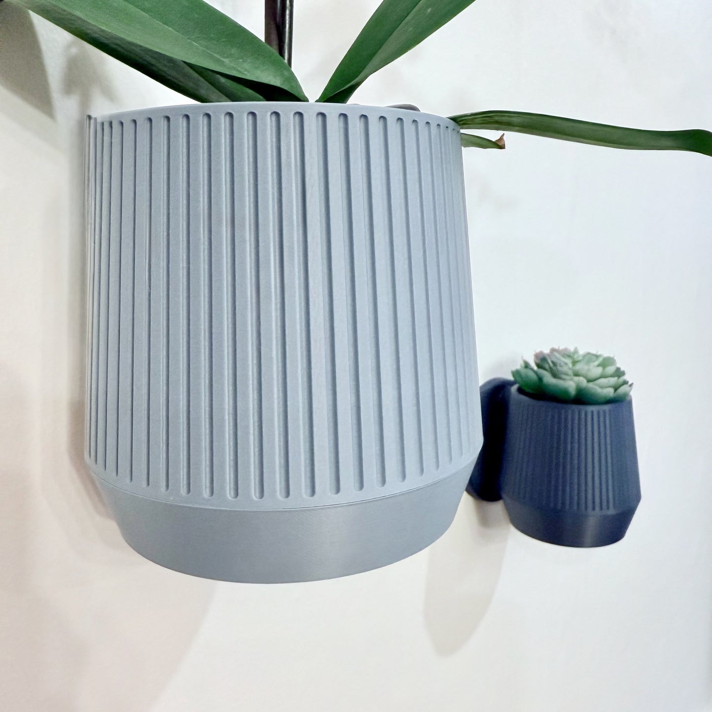 Mid-Century Modern wall planter with clean lines and timeless style, available in a variety of colors to complement any space.