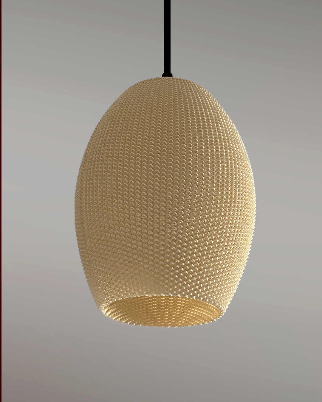 Elegant Ovo Lampshade featuring a textured surface in a natural color, suspended from the ceiling for modern decor.