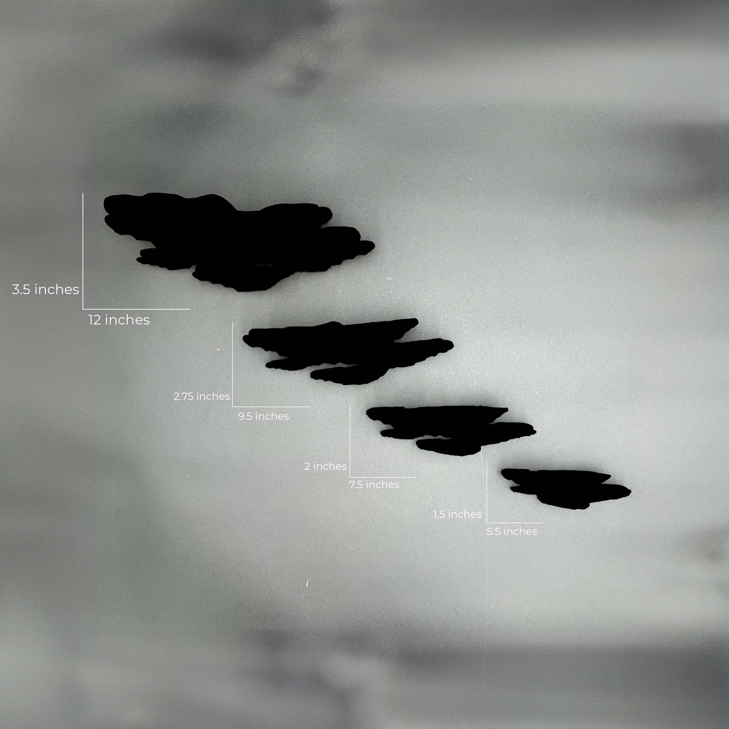 Measurement guide for the Ostrea Mushroom Floating Shelves displayed against a monochrome background, indicating sizes from small to large.
