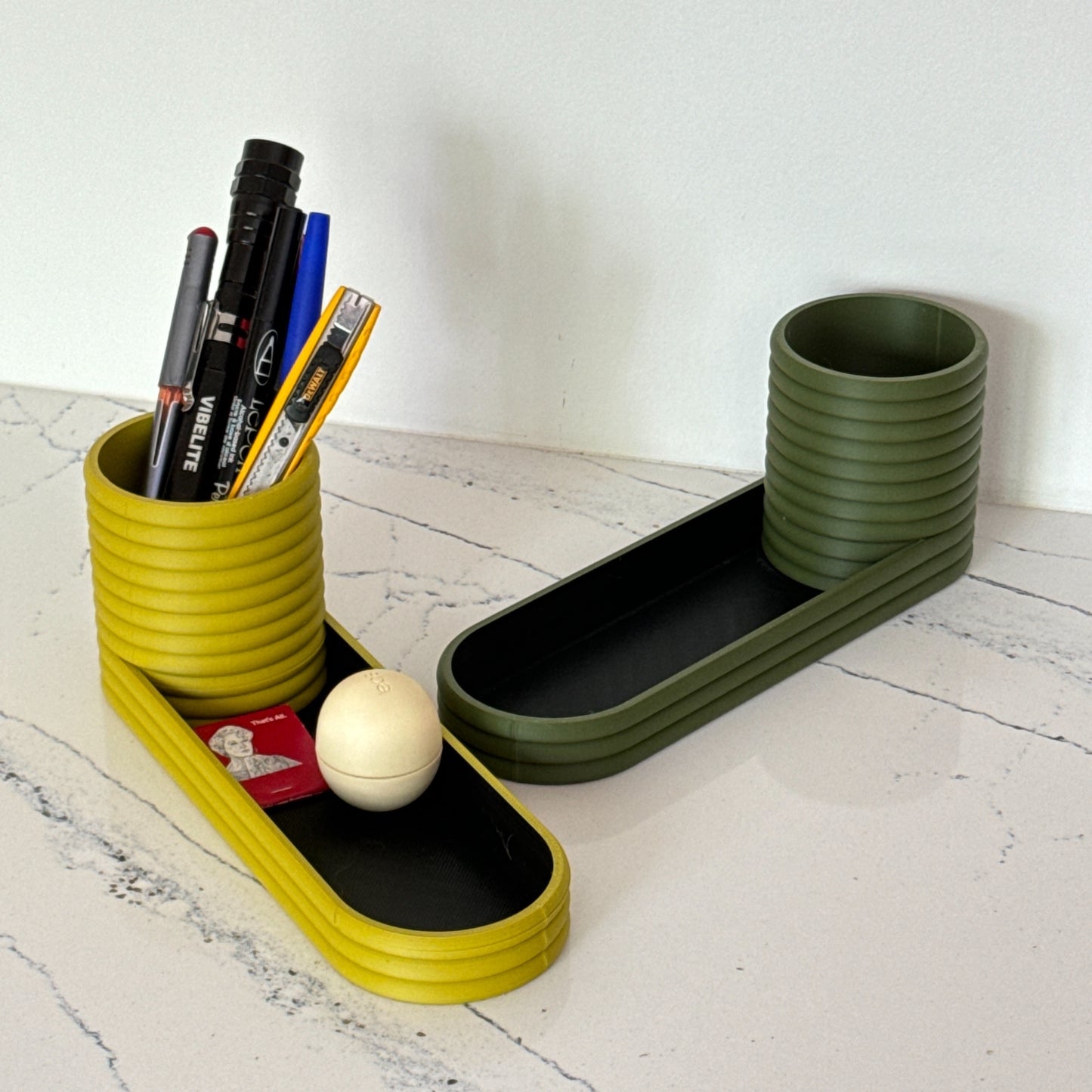 A stylish and versatile mini planter and valet tray combo, perfect for organizing keys, desk supplies, or small plants.