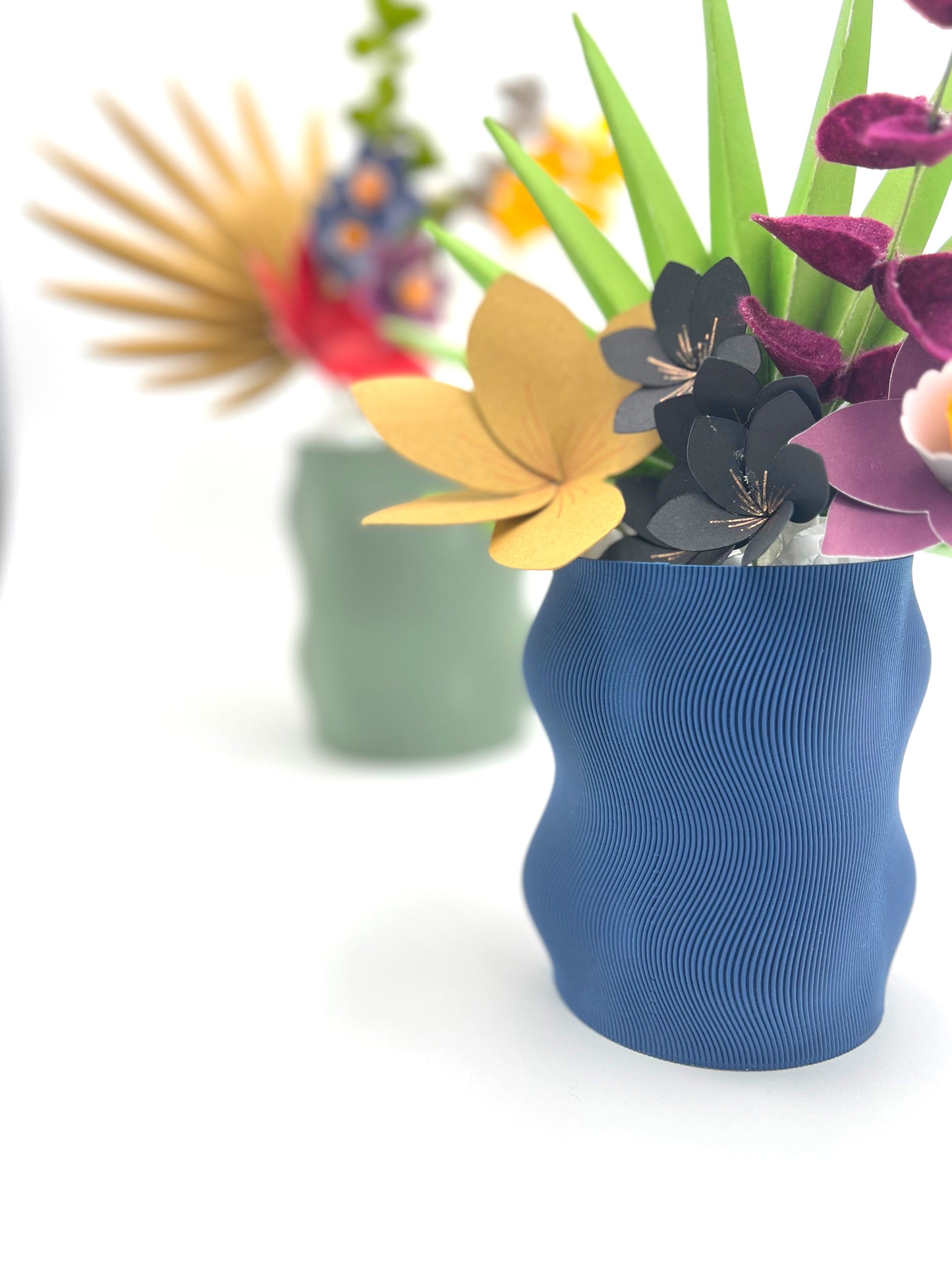 Curvy Modern Planter in beautiful matte finish showcasing its added drainage hole and under plate for plant care.