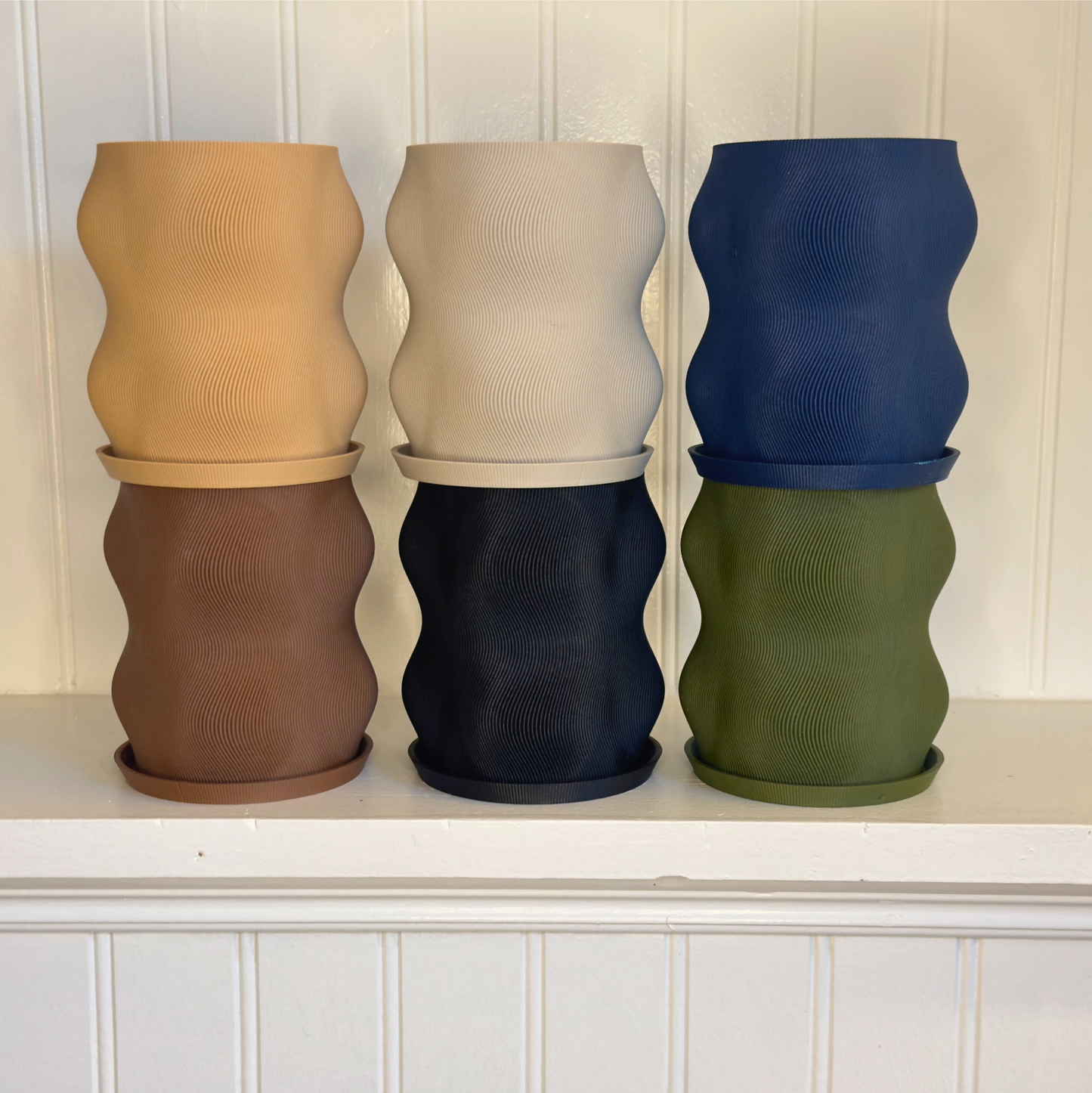 Eye-catching Curvy Modern Planter shown in an elegant setting with greenery, combining style and sustainability.