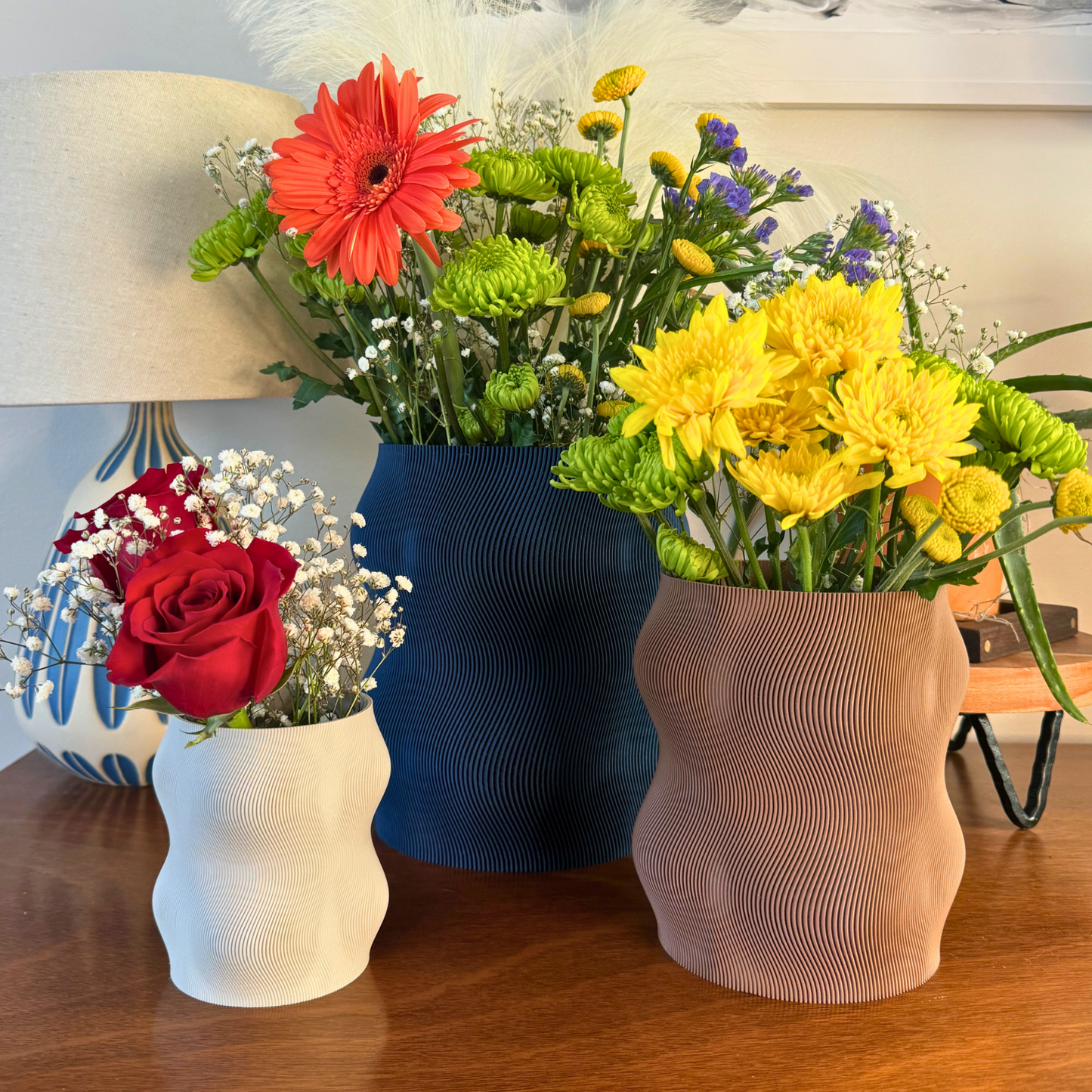 Stylish Curvy Modern Planter with drainage hole and under plate in matte color, perfect for indoor gardening.