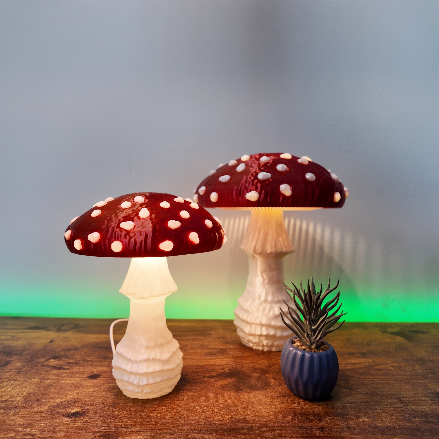 Light Inspired unique light inspired table lamps featuring whimsical mushroom designs with a vibrant red cap and white spots, illuminating a cozy setting. Perfect accent pieces for nature-themed home decor.