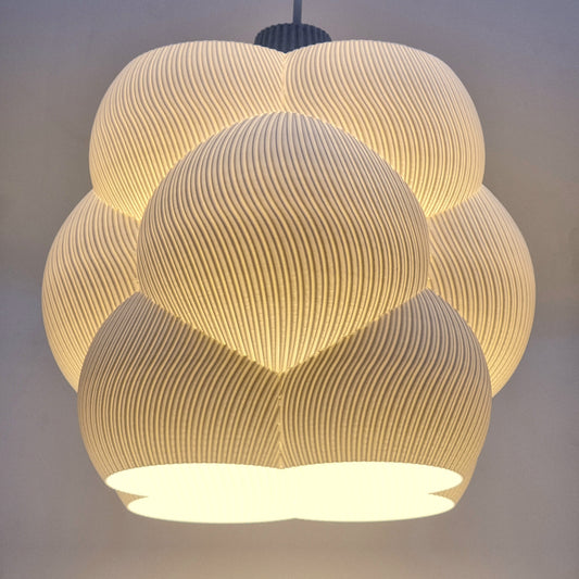 Cumulus Cloud lampshade featuring a modern sculptural design with textured, fluid lines and an elegant glow, perfect as a statement decorative piece.