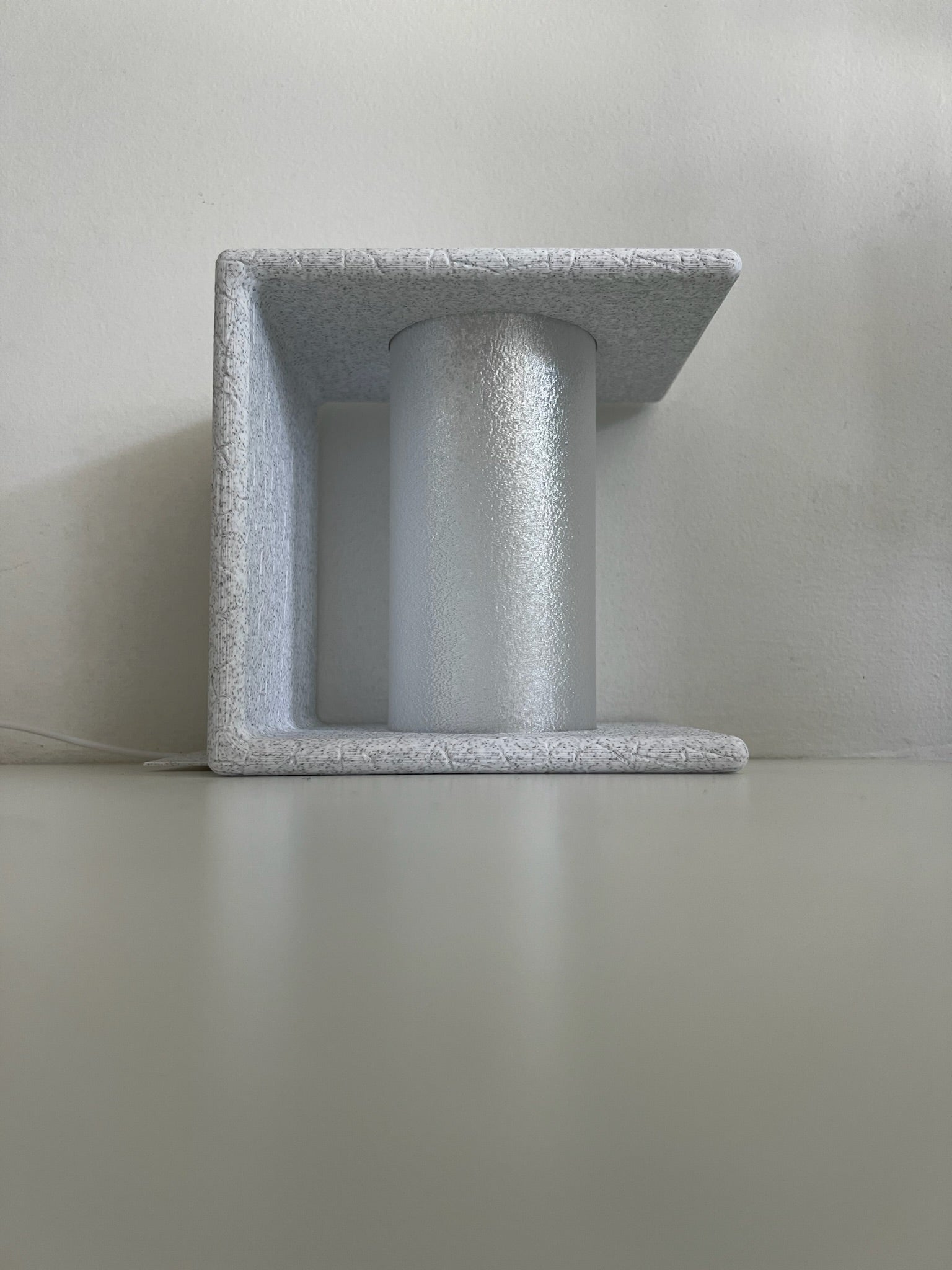 Ancient Marble Bookend displaying a unique design with warm lighting aesthetics.