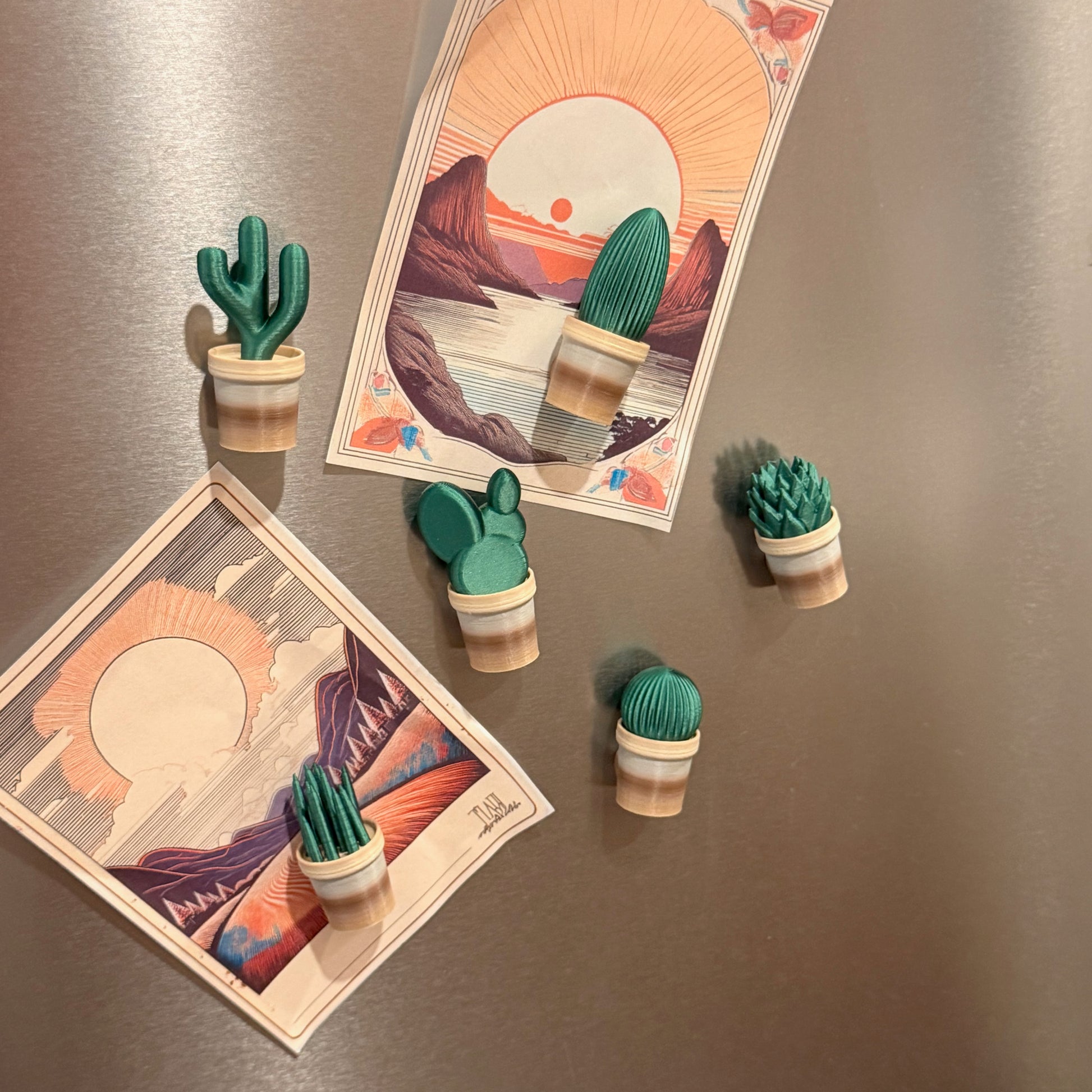 Mini Cactus Plant Pot Collection - Set of 6 Fridge Magnets displayed on a fridge, showcasing cactus and succulent magnets holding artwork, ideal for decor with cactus fridge magnets.