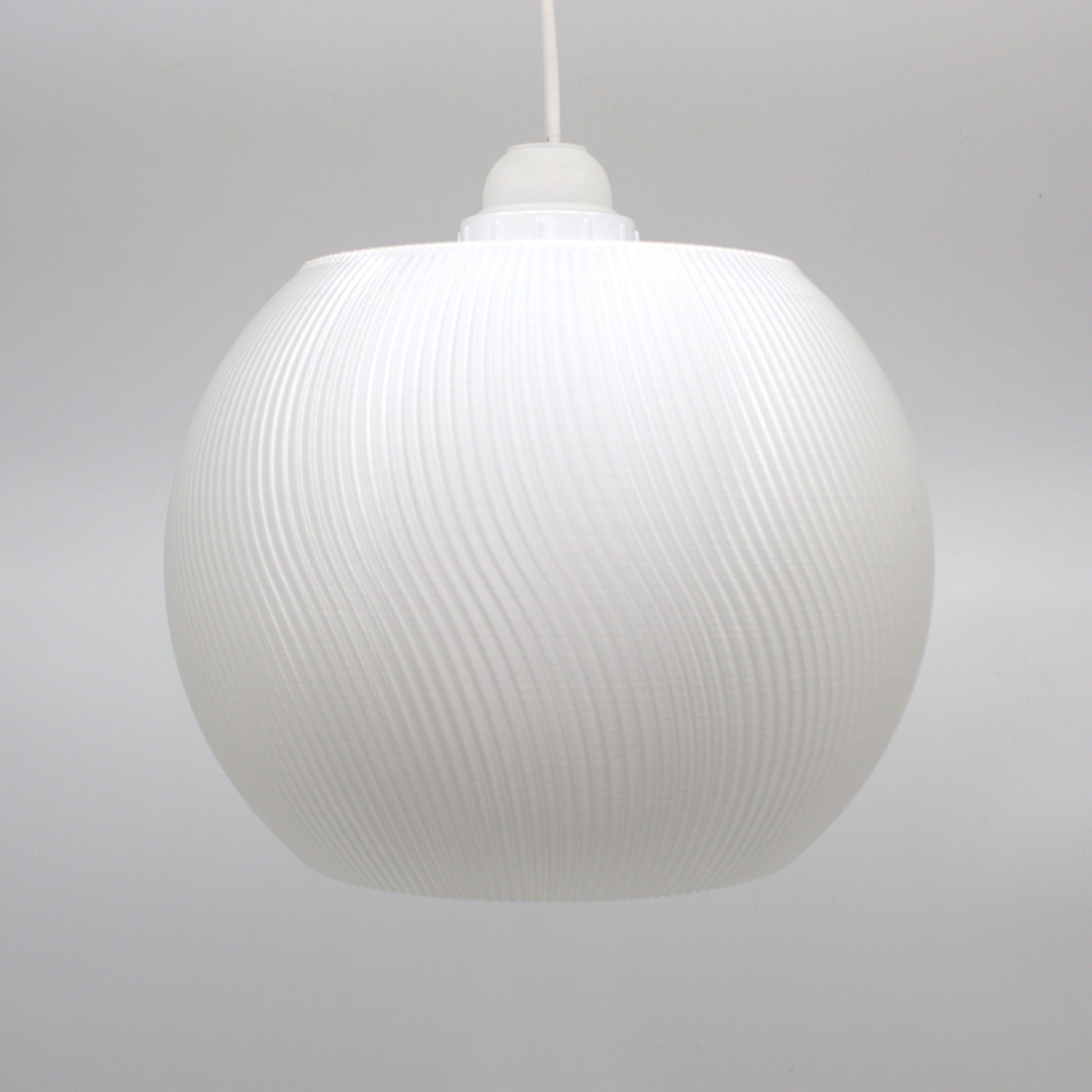 Elegant white lampshade with a ribbed texture, ideal for creating a cozy atmosphere in any room.