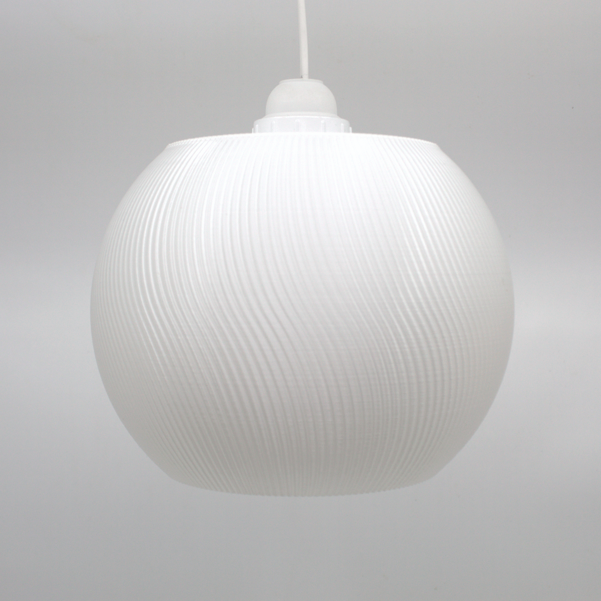 Modern white lampshade with a textured surface, perfect for adding a whimsical touch to home decor.