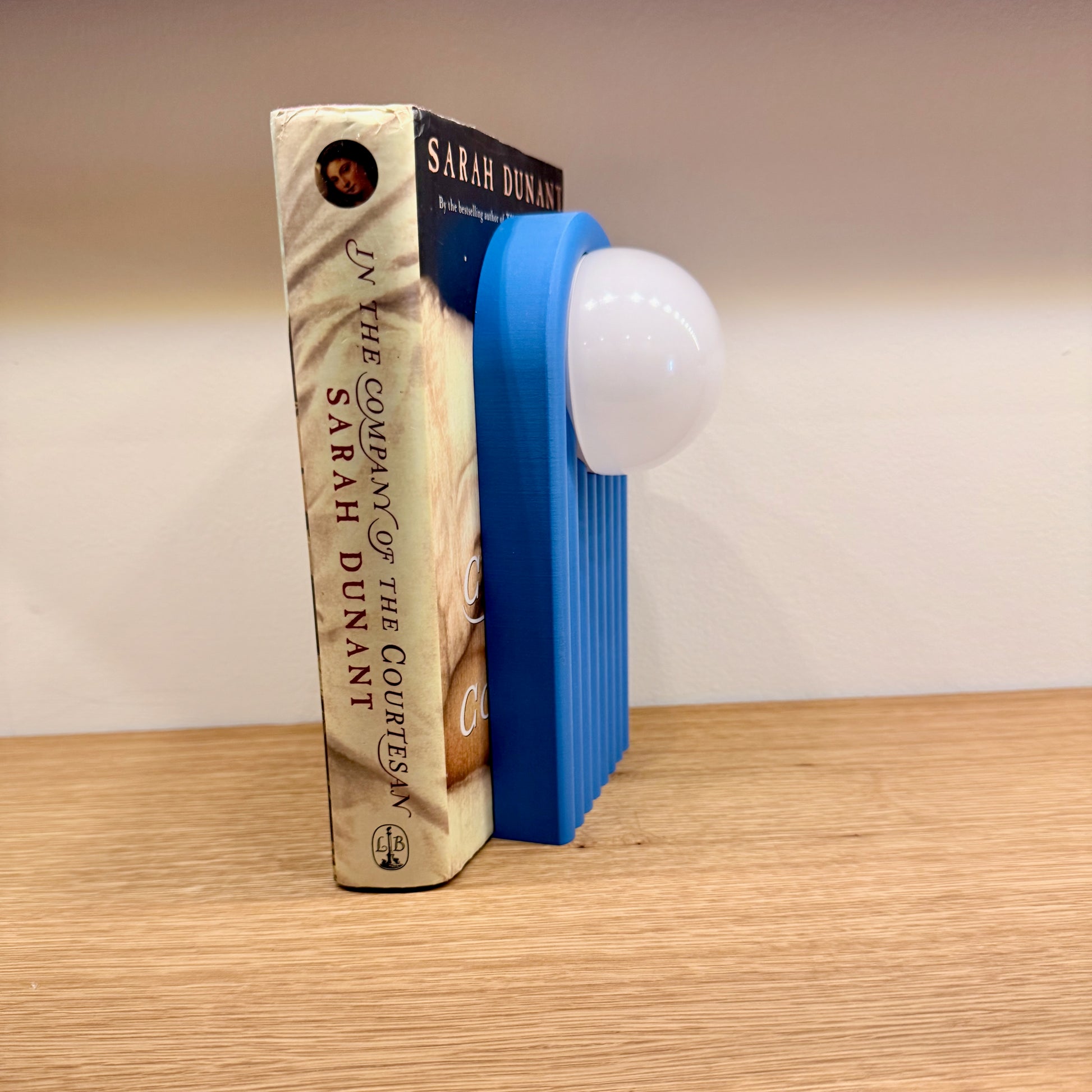 Retro Chic Lighted Bookend for Kids Room or Library featuring a close-up of a blue lighted bookend, perfect for enhancing your decor with a soft ambient glow.