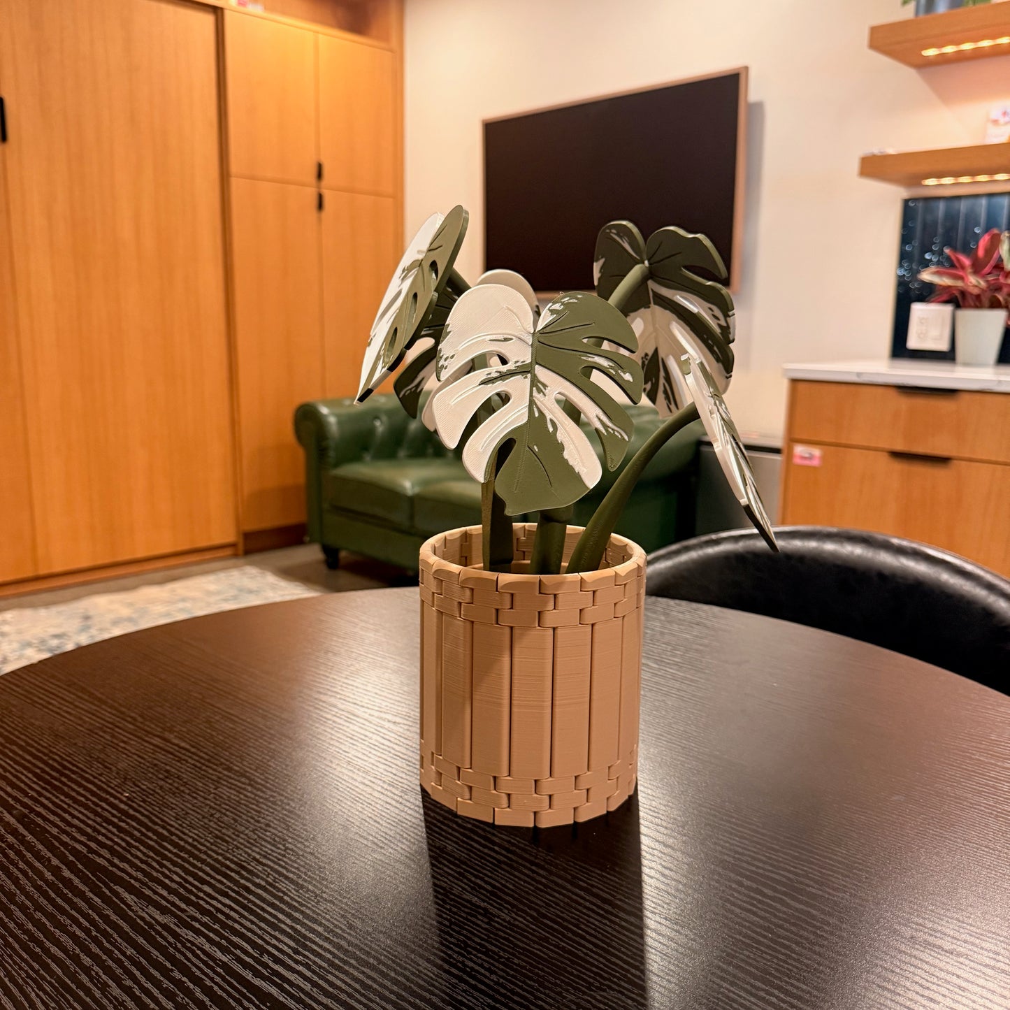 Variegated Monstera Coaster Set displayed in a decorative living room caddy featuring a stylish armchair valet.