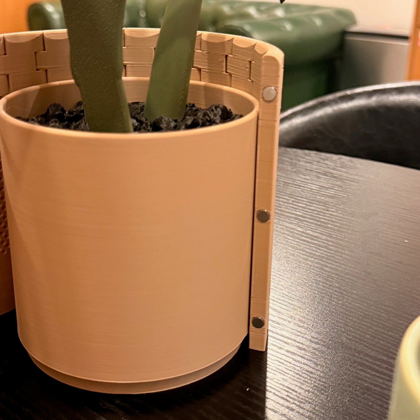 Close-up of the Variegated Monstera Coaster Set in a pot, featuring magnetic leaves and a stylish terracotta base.