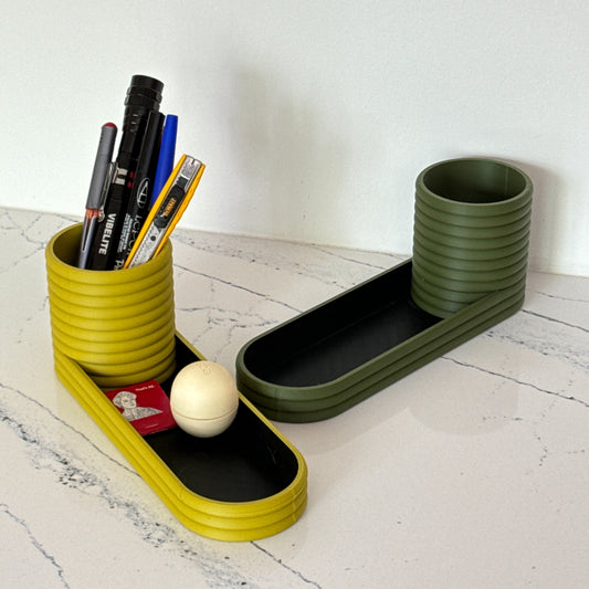 A stylish and versatile mini planter and valet tray combo, perfect for organizing keys, desk supplies, or small plants.