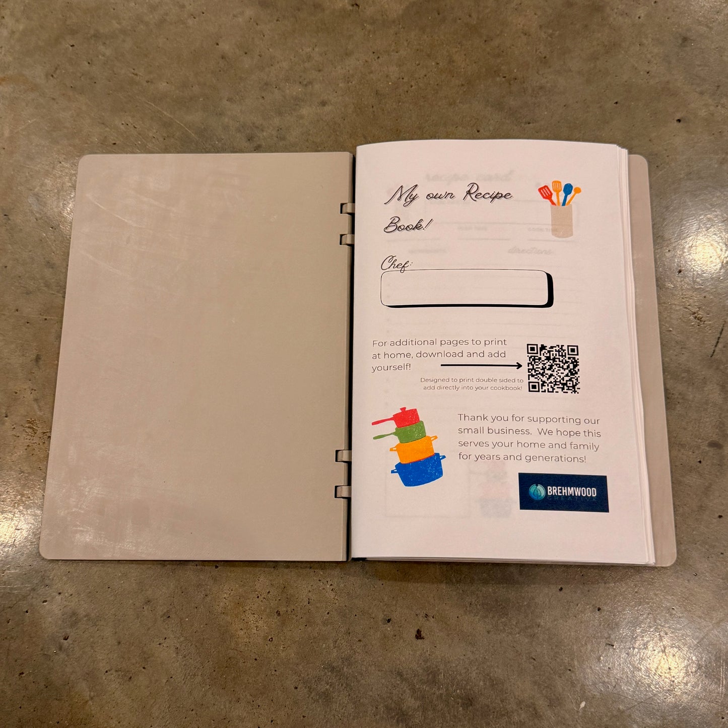 The inside cover of the 'I Am Writing My Own Cookbook' featuring a blank page titled 'My own Recipe Book' with space for personal touches, designed for culinary creativity.