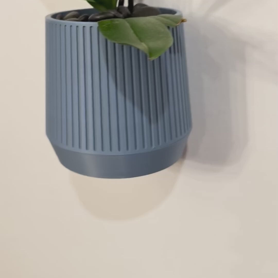 Sleek and simple MCM-inspired planter, designed to bring a retro yet modern touch to your home in 20 stylish colors.